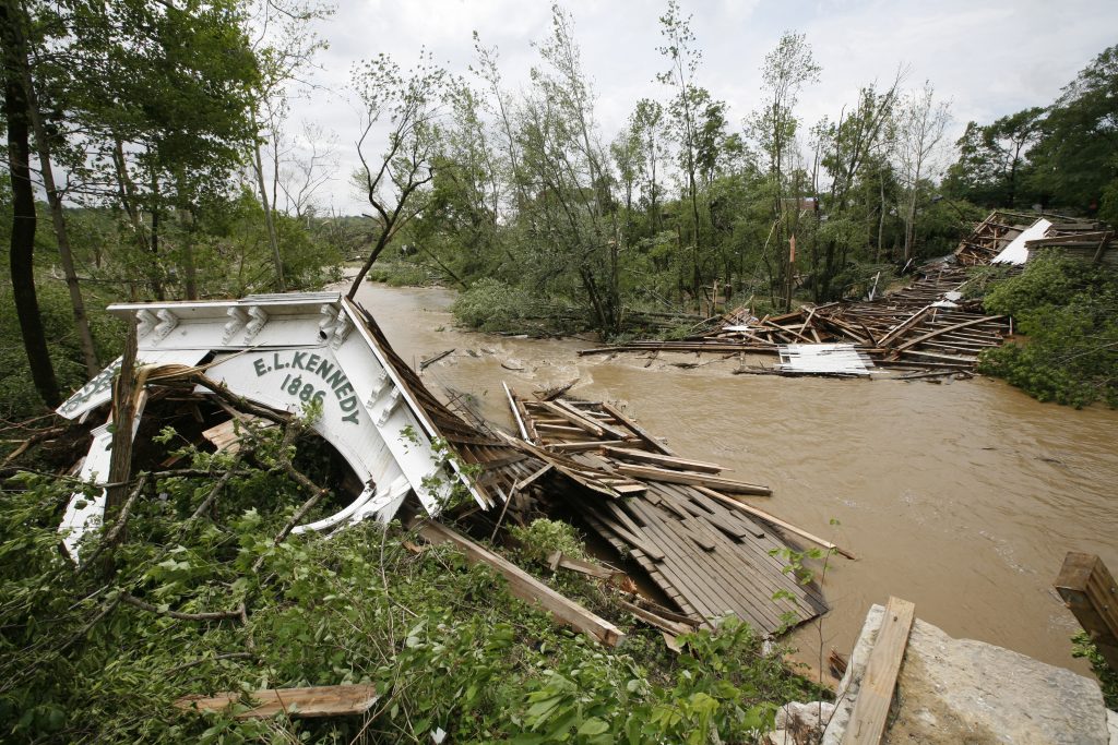 The remains of the Moscow covered bridge stretches across the water Wednesday June 4, 2008 after the historic landmark was destroyed by an overnight tornado in the small Rush County town. (Photo: Mike Fender, Indianapolis Star)