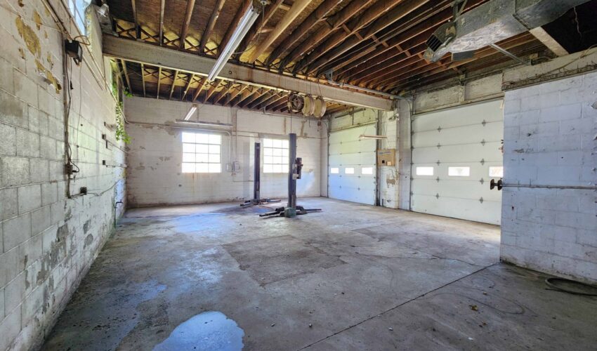 Interior of service station on Oxford's towns square before rehabilitation.